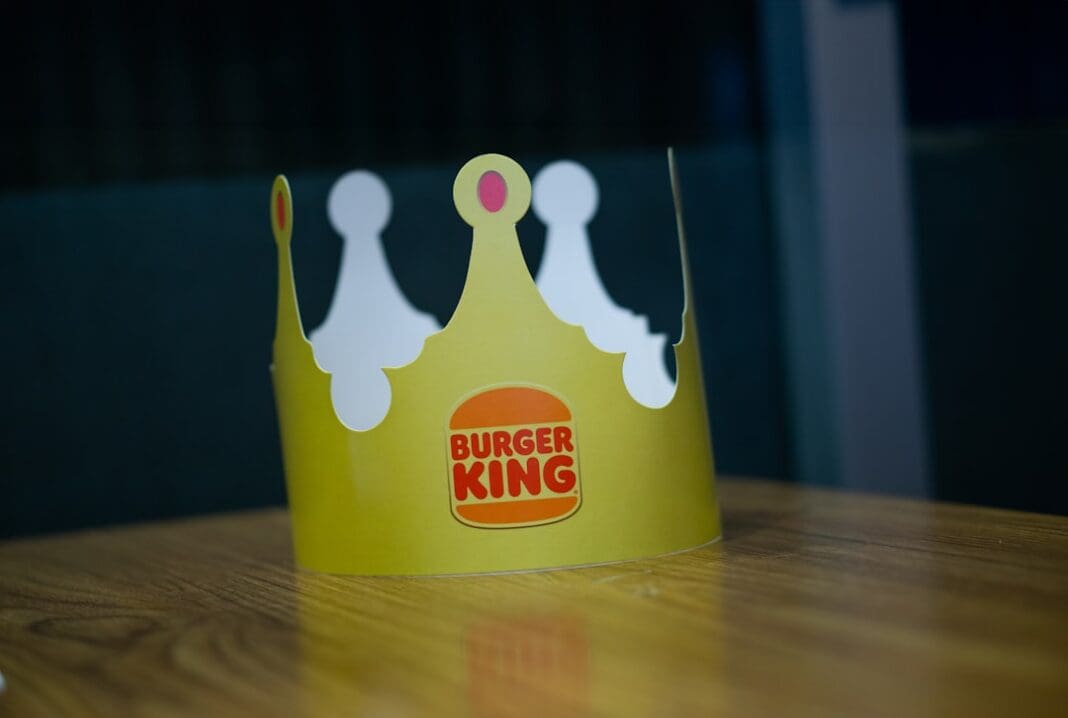 a paper crown sitting on top of a wooden table | Photo by litoon dev on Unsplash